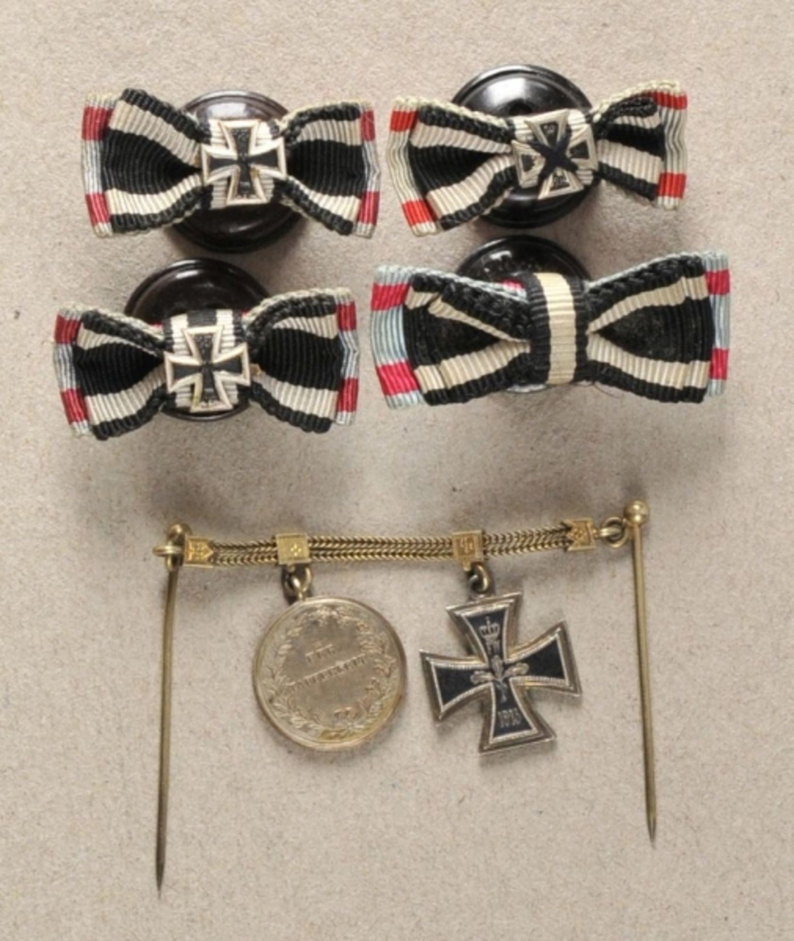 Hesse: small property of a brave Hesse. Miniature bracelet and sundry botton hole decorations.