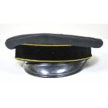 Visor disc. Black visor, black band, yellow piping, the black peak loose, brown sweath leather,