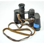 Binoculars. Black laquered body with leather structure, one occular fitting missing, marked ETABL TS