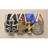 Great curly sewed medalbar with 4 decorations. 1.) Prussia: Iron Cross, 1914, 1st class; 2.)