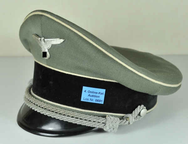 Collectors copy of an SS-Officers visor cap. Field grey fabric, black band, white piping, silver