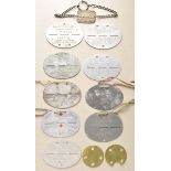 Lot of 10 dog tags. - A 1./J.R. 35, 123; - Karl Bauer, Grossheppach oA. Waiblingen, 15.8.89, Felda.