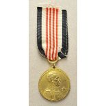 Opening: 50 EUR    0.1.) Collection Rick Lundström  Colonial votive medal.  Gilded, on ribbon.