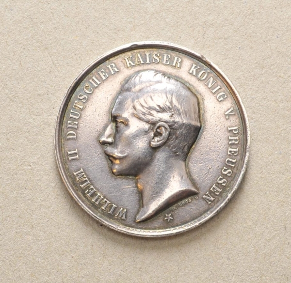 Medaille "Königs-Prämien Schiessen 1894".Silber, graviert, Henkelung wohl entfernt.Zustand: