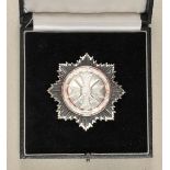 1.3.) Bundesrepublik Deutschland und DDRDeutsches Kreuz, in Silber, 1958, im Etui.Versilbert und