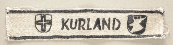 1.2.) Deutsches Reich (1933-45)Ärmelband "KURLAND".Tuch im Fischgrät-Muster, schwarz bestickt mit