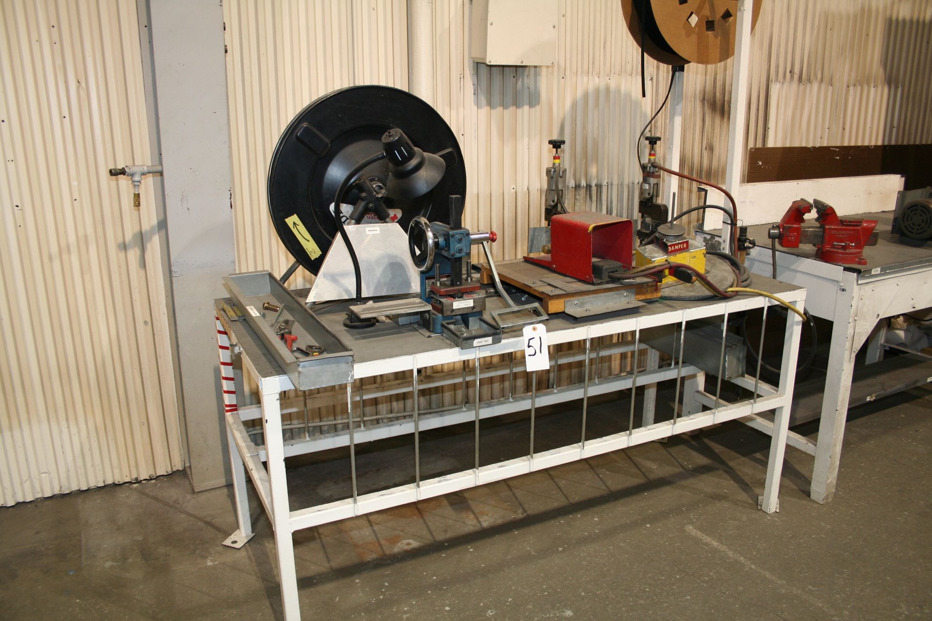 Table with #1 Arbor Press, (2) Air Presses, (2) Payoffs and Cutter