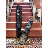 A pair of late 17th/18th century carved oak posts, each with a floral rosette over a naively