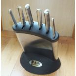 A Global knife block containing six stainless steel knives, and a good collection of kitchen