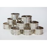 A set of twelve silver napkin rings, Mappin & Webb, Birmingham 1986 & 1987, each with bright cut