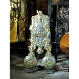 A pair of late 17th century style brass 'Royal' andirons, each heightened with 'Surrey'
