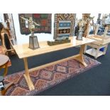 A late 20th century craftsman made figured timber refectory table, probably ash and beech, raised on