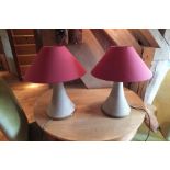 A pair of nautical capstan design table lamps, each having turned wood top and base with rope