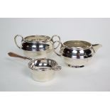 A silver sugar bowl and cream jug, S.W. Smith & Co, Birmingham 1918, each piece of squat circular