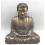 A 20th century gilded composition seated Buddha in lotus position, 70cm wide, 73cm high illustrated