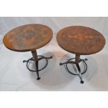 A pair of "Michael Reed Design" of London wine tables, having quarter veneered burr tops, on ring