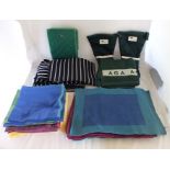 A quantity of "Aga" towels, aprons, and oven gloves, together with coloured Indian place mats, and a