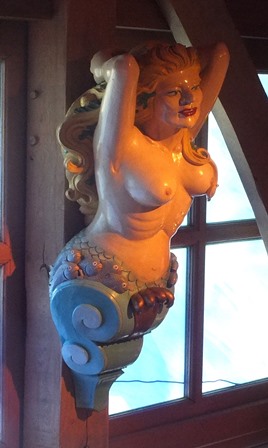 A 20th century carved wood and painted ship's figure head, in the form of a topless young woman with - Image 2 of 3