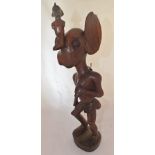 An African tribal wood carving, figure with distorted features, 41cm high