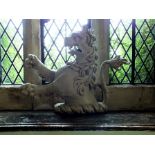 A painted and carved pine lion rampant armorial crest, 56cm high, 71cm wide illustrated