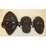 Two West African Dan masks and one Poro secret society mask Liberia