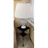 A large white crackle glazed pottery table lamp, supported on a painted woven wicker two-tier lamp