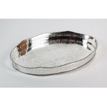 An oval silver plated gallery tray, with central bright cut engraved foliate decoration and