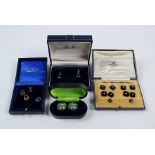 A cased set of onyx and split seed pearl set cufflinks and dress studs within original Mappin & Webb