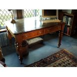 A Victorian mahogany beech wood library table, the rectangular top with moulded edge and rounded