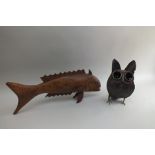 A carved wood fish with glass eyes, 74cm, together with a welded sheet metal owl, 40cm high