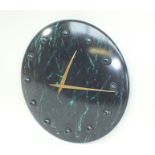 A "Karlsson" wall clock, circular convex marbled metal finish, battery movement, 40cm diameter