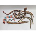 A quantity of bead and painted wood American snakes