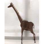 A novelty bead work free standing giraffe, on metal frame, 64cm high