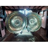 A pair of 17th century style, German brass circular alms dishes, the 19th century, domed and