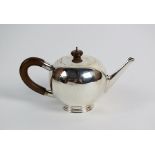 A silver Britannia standard bullet shaped teapot, Edwards & Sons, London 1936, of plain polished