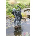 A 20th century bronze fountain figure in the form of a winged cherub riding on the back of an exotic