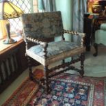 A late 17th century Flemish walnut elbow chair with twist, ring and baluster turned frame,