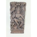 A 20th century Indian carved wood panel of Shiva dancing, 30cm wide, 61cm high