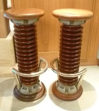 A pair of bar stools assembled from glazed ceramic and metal coils from a power station, with - Image 2 of 2