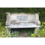 A 19th century carved stone bench of classical revival taste, the back inset a lead panel of