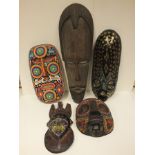 A Ghanaian mask, an East African mask, a Guatemalan mask and two West African tribal style masks (5)