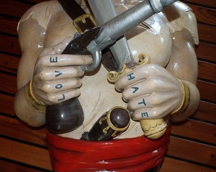A 20th century carved wood and painted ship's figure head in the form of a Pirate wearing a red - Image 3 of 7