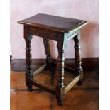 A 17th century oak joynt stool, the rectangular seat with moulded edge, the rails carved a simple