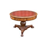 An early 19th century oak and pollard oak centre, or drum table, the top inset with tooled hide,