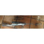 A rifle design clay pigeon projector, with wooden stock and trigger mechanism, 116cm long,