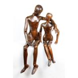 Two early 19th century carved wood and articulated artist's lay figures, 99cm and 80cm high