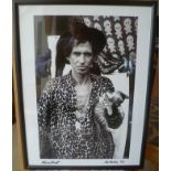 A black and white portrait photograph of Keith Richards, taken by Alan Strutt in Barbados, signed