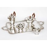 A matched four piece silver tea service, Walker & Hall, Sheffield 1925, 1933 and 1934 and James