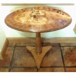 A 19th century pollard oak, fruitwood and marquetry oval table, the top inlaid with a coat of