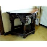 An early 17th century and later oak demi lune credence table, the fold-over top with rear gateleg